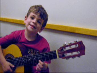 boy playing guitar